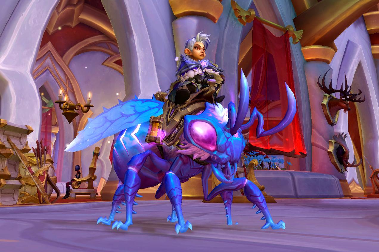 A female gnome at the Decor Duel location in Silvermoon astride a grounded Magisters Spell Bee: a cobalt blue bee mount with hot pink eyes and flaming pink stripes along its abdomen.